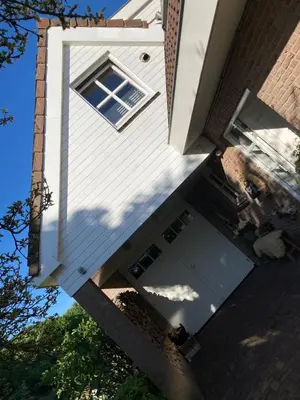 an open door of a house with a window at B&BOosterweg3 Studio - Free private parking in Heemskerk