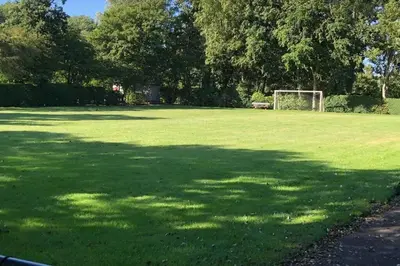 a large field of grass with a soccer goal at Have a nice stay! - Vakantiehuis de Schelp op rustig park in Noordwijk