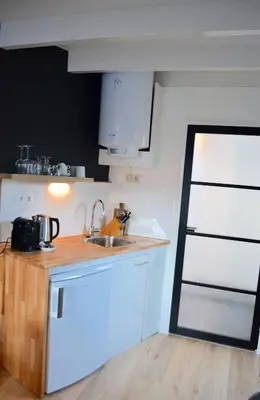 a kitchen with a sink and a counter top at Studio/appartment EVI in Zandvoort