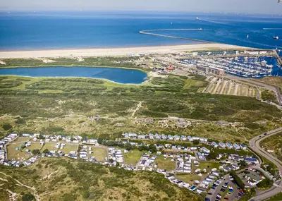 an aerial view of a resort near the beach at Luxe Chalet Marbella IJmuiden aan Zee in IJmuiden