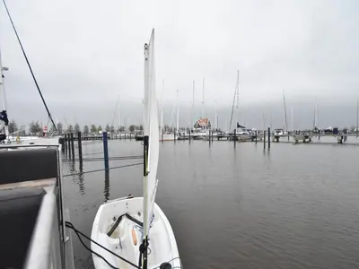 a boat is docked at a dock in the water at Boat in Volendam near Marina Museum in Volendam