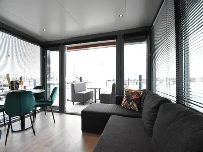 a living room with a couch and a table at Boat in Volendam near Marina Museum in Volendam