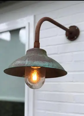 a light hanging from the side of a house at Klein Oldenburg in Bergen