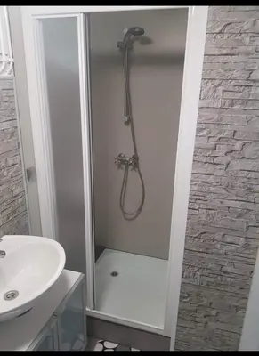 a bathroom with a shower and a sink at Cozy chalet in Opmeer near Amsterdam and Beach in Opmeer