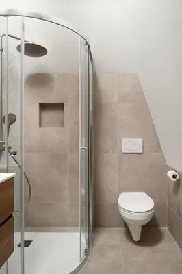 a bathroom with a toilet and a glass shower at Beachhouse SeaBreeze - vernieuwd! in Noordwijk