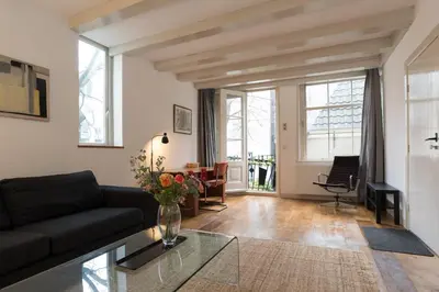 a living room with a couch and a table at Kloveniers Studio in Amsterdam
