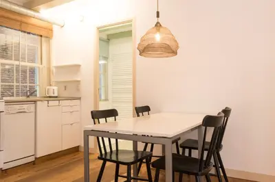 a kitchen and dining room with a table and chairs at Kloveniers Studio in Amsterdam