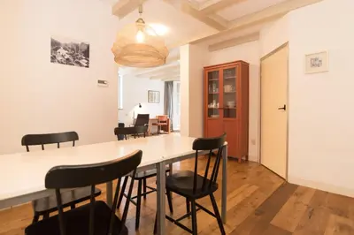 a kitchen and dining room with a table and chairs at Kloveniers Studio in Amsterdam