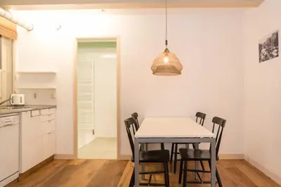a kitchen and dining room with a table and chairs at Kloveniers Studio in Amsterdam