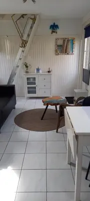 a living room with a couch and a table at 't Koerhaus in Egmond aan Zee