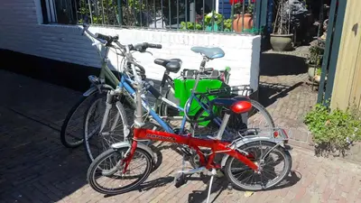 two bikes parked next to each other on a sidewalk at The New Fisherman’s House in Zandvoort
