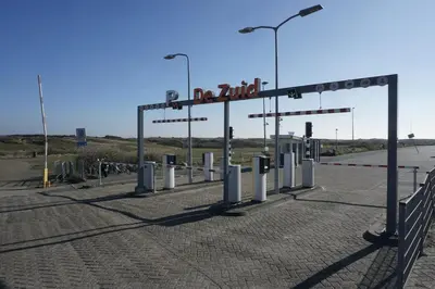 a gas station with a sign on the side of a road at The New Fisherman’s House in Zandvoort