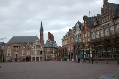 a city square with buildings and a clock tower at Chalet Playa direct aan zee in IJmuiden in IJmuiden