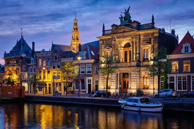 a group of buildings next to a river at Haarlem Apart Hotel in Haarlem