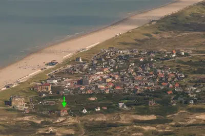 an aerial view of a town next to a beach at Villa Parnassia in Bergen aan Zee