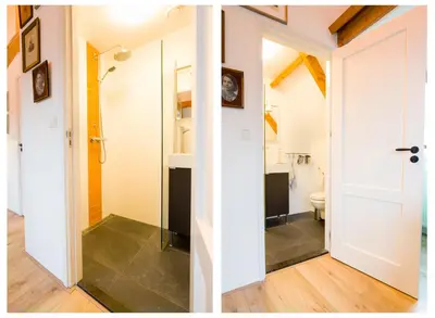 a bathroom with a shower and a toilet in a room at At the Butchers in Amsterdam