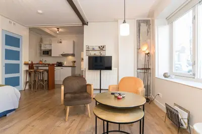 a living room with a bed and a table at Luttik Oudorp 30 in Alkmaar