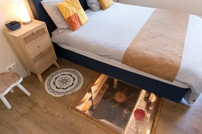 a bedroom with a bed with a fire place under it at Luttik Oudorp 30 in Alkmaar