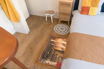 a bedroom with a fire place in the floor at Luttik Oudorp 30 in Alkmaar
