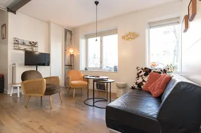 a living room with a couch and a table at Luttik Oudorp 30 in Alkmaar