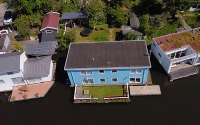 an aerial view of a house in the water at Amster Houseboat in Amsterdam