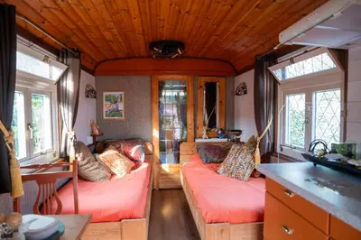 a living room with two couches in a house at De Wagen in Egmond-Binnen