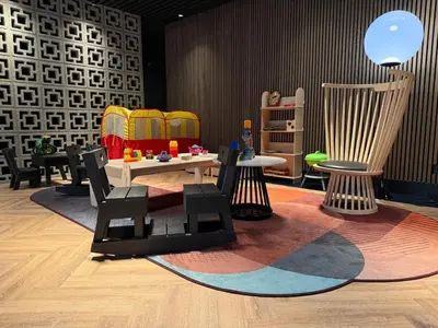a room with a table and chairs on a rug at The Florian Amsterdam Schiphol Airport, WorldHotels Crafted in Hoofddorp