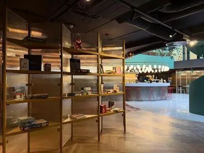a room with shelves with books in a store at The Florian Amsterdam Schiphol Airport, WorldHotels Crafted in Hoofddorp