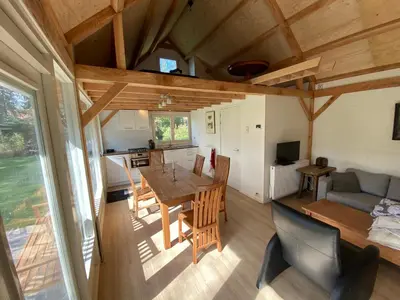 a kitchen and living room of a tiny house at Garden find zandvoort in Bentveld