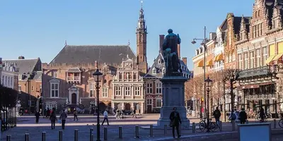 a statue in the middle of a city with buildings at Garden find zandvoort in Bentveld