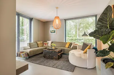 a living room with a couch and a table at Villa Merici in Bergen