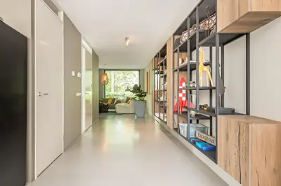 a hallway of a home with wooden shelves at Villa Merici in Bergen