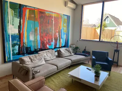 a living room with a couch and a table at Luca’s Loft in Bergen