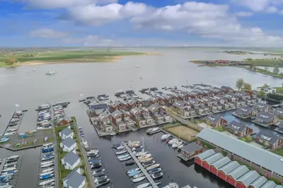 an aerial view of a harbor with boats in the water at Meerzicht 70 - Vakantiehuis aan het water! in Uitgeest