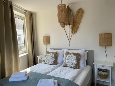 a bedroom with a bed and a window at Pure Apartment in Zandvoort