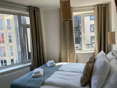 a bedroom with a bed with two towels on it at Pure Apartment in Zandvoort
