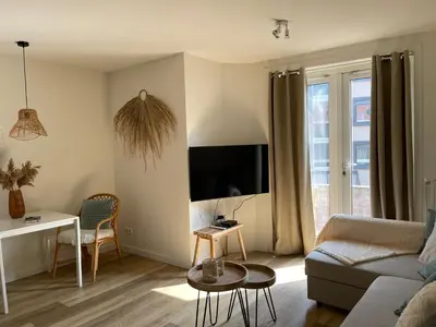 a living room with a couch and a table at Pure Apartment in Zandvoort