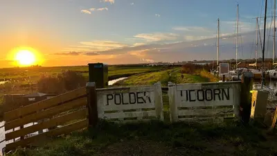 a sign for a police station with the sunset in the background at Lovely holiday house in Durgerdam in Amsterdam