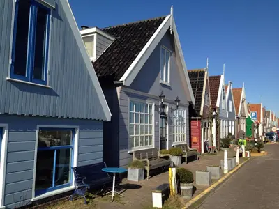 a row of houses on the side of a street at Lovely holiday house in Durgerdam in Amsterdam
