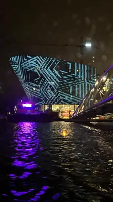a view of a building at night from the water at Lovely holiday house in Durgerdam in Amsterdam