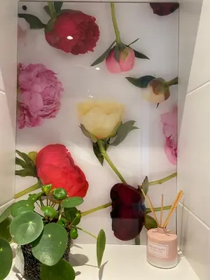a wall with a bunch of flowers on it at Paauwze in Rijnsburg