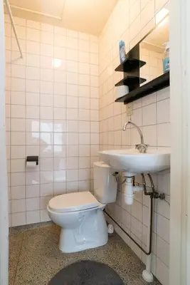 a bathroom with a toilet and a sink at RedLight District Private Smokers Friendly Studio in Amsterdam