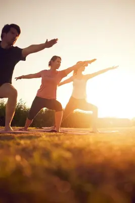 three people standing in a field with their arms outstretched at Dutchen Erfgoedpark De Hoop Appartementen in Uitgeest