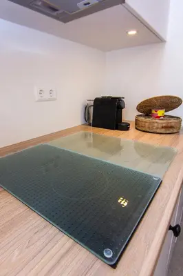 a black mat on top of a wooden counter at Coast Guesthouse in Zandvoort