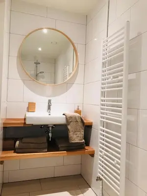 a bathroom with a sink and a mirror at Guest House Amersfoort Center in Amersfoort