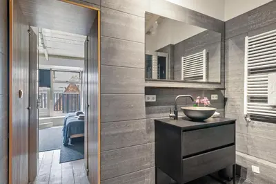 a bathroom with a sink and a mirror at Adam's loft in Amsterdam