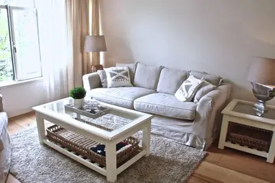 a living room with a couch and a coffee table at Stylish Canalhouse B in Amsterdam