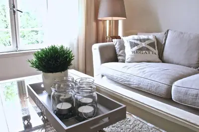 a living room with a couch and a coffee table at Stylish Canalhouse B in Amsterdam