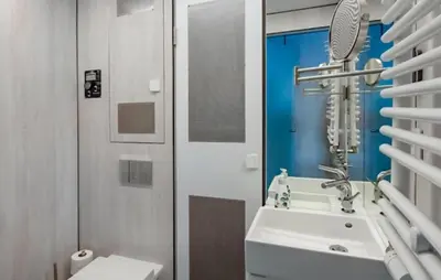 a bathroom with a sink and a mirror at Mermaid-Hausboote 2 in Lelystad