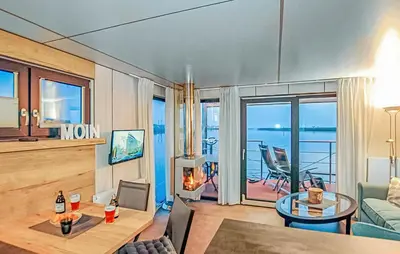 a living room with a view of the ocean at Mermaid-Hausboote 2 in Lelystad